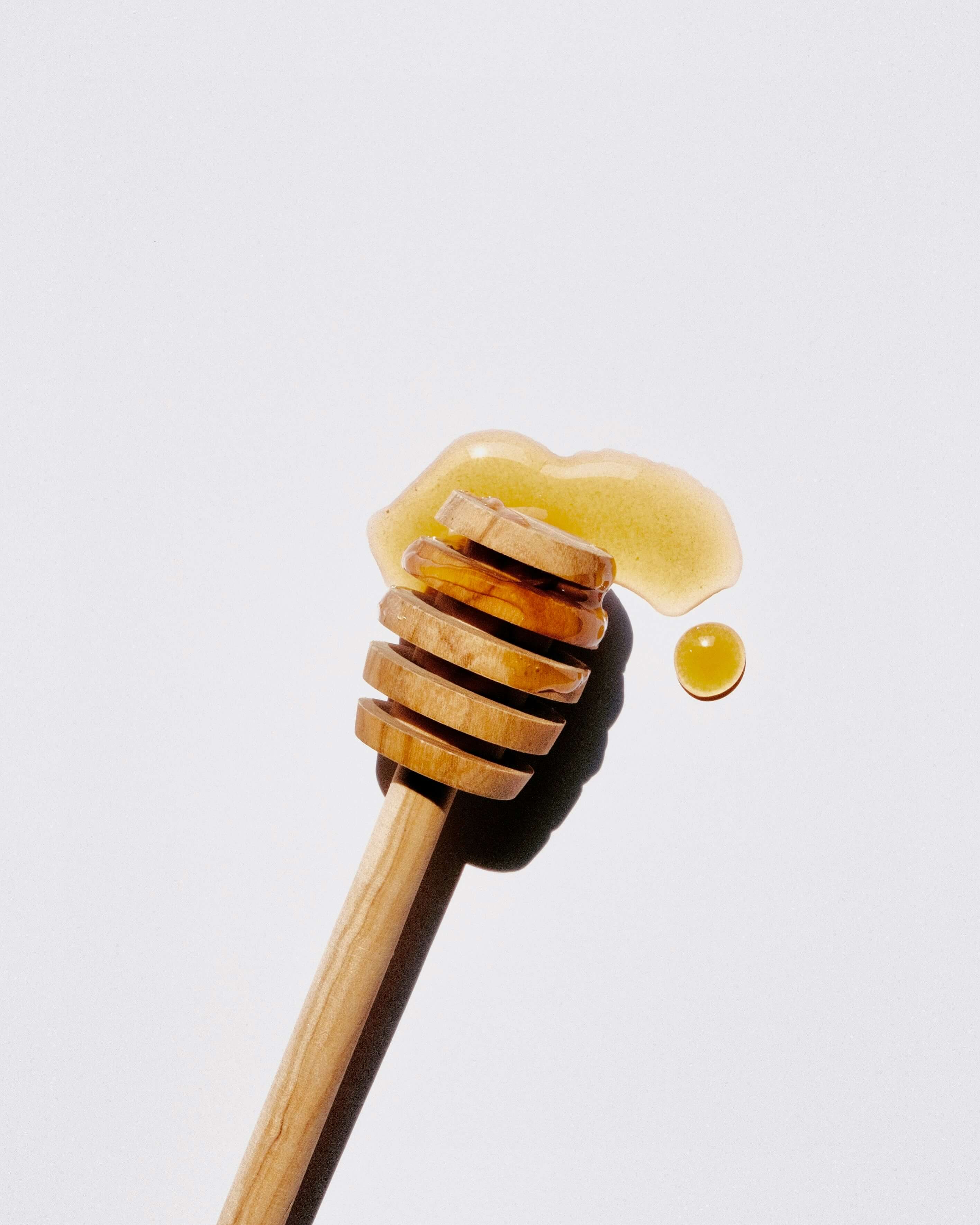 Image of honey wand with local honey on it